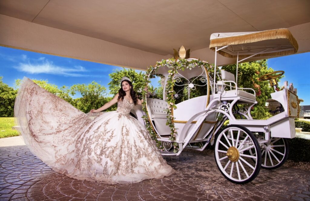 Villas photoshoot at Villa Toscana Miami featuring a quinceañera in a gold-embroidered gown posing with a white Cinderella-style carriage.