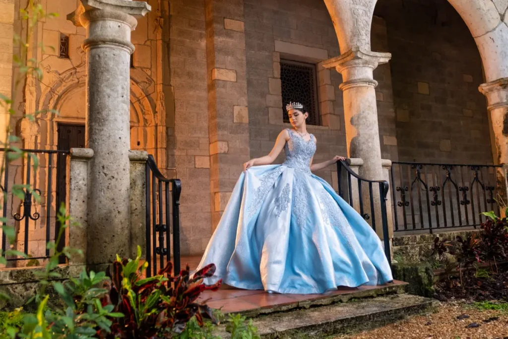 Castle quince photography at the Spanish Monastery: blue gown by stone arcades with warm sunset light.
